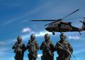 Special forces soldiers in tactical gear with helicopter overhead under a blue sky.