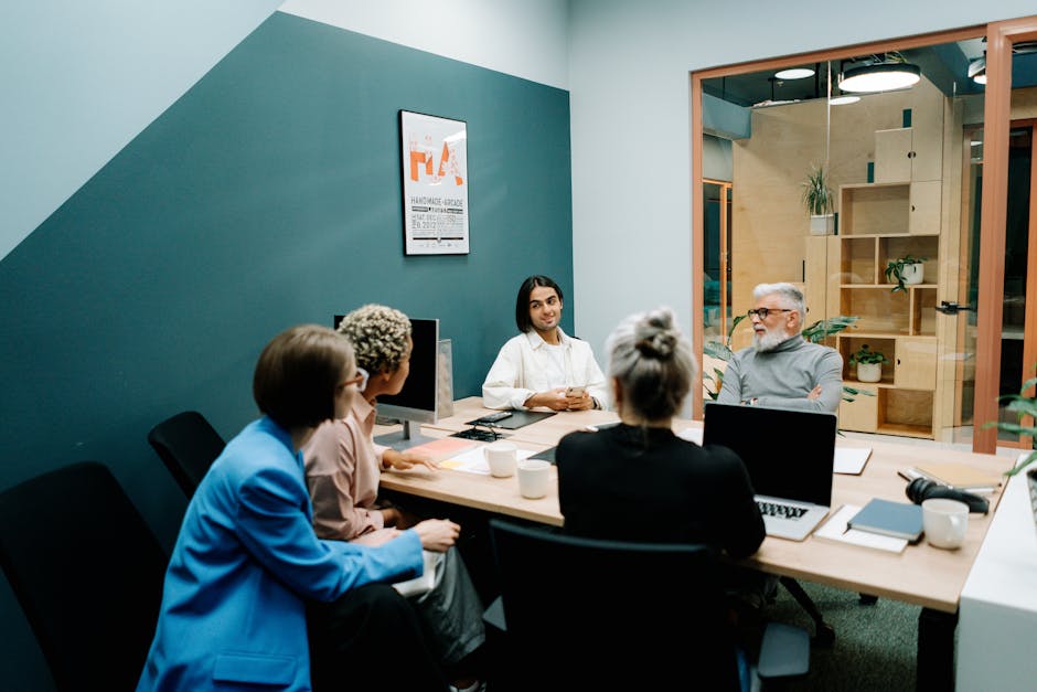 Group of young professionals in a discussion.