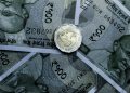Detailed close-up of Indian 500-rupee notes and a 20-rupee coin, highlighting currency details.