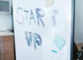 Creative startup concept handwritten on a whiteboard, symbolizing innovation in business.