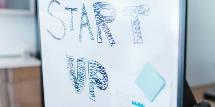 Creative startup concept handwritten on a whiteboard, symbolizing innovation in business.
