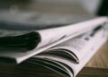Consolidation’s Quiet Coup: How Media Ownership Shifts Are Reshaping Community Newsrooms and Career Capital