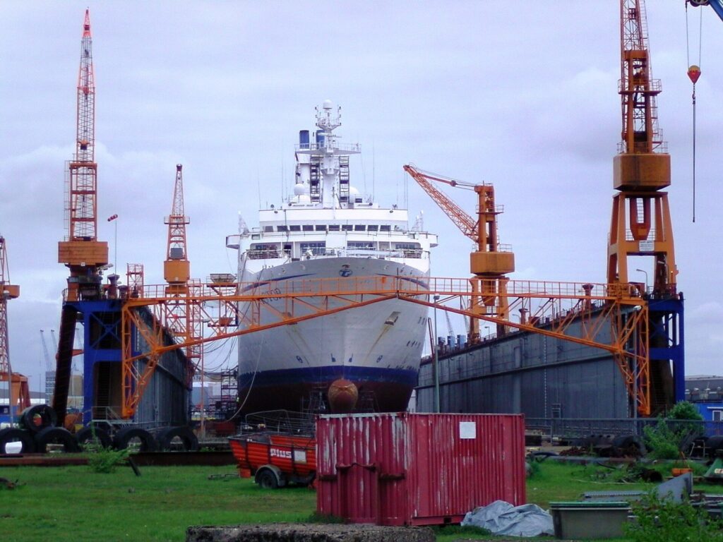 The cruise ship Astor docked at Lloyd shipyard in Bremerhaven, illustrating the suspended Odyssey cruise after fuel funds ran out.
