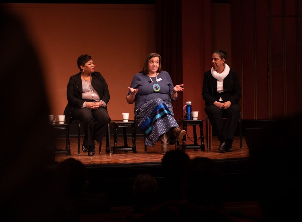 A panel of community leaders seated together, illustrating education leaders discussing early university succession.