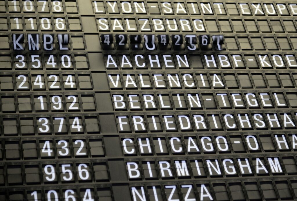 Photo showing travel, flight, schedule and ad.
