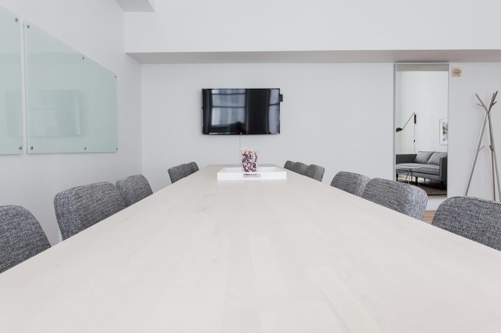 A boardroom with chairs and a table, illustrating the setting for CEO authority discussions.
