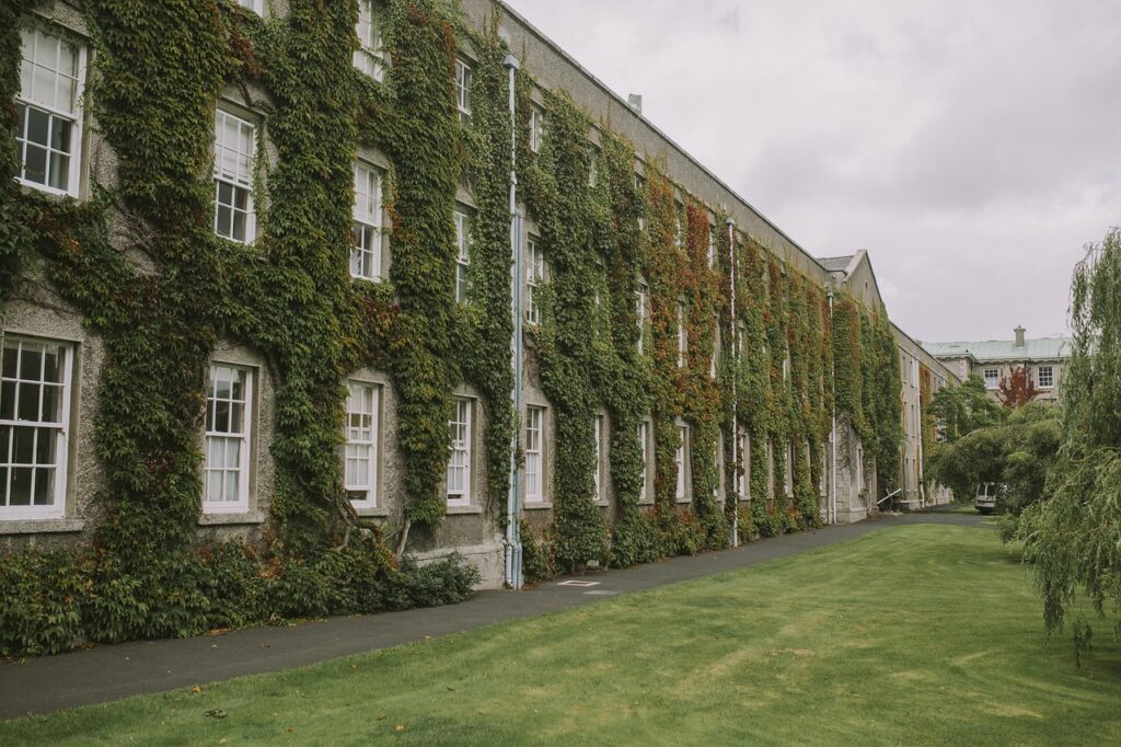A mansion covered in autumn ivy and foliage, illustrating Emory University's campus setting.