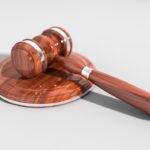 A wooden gavel on a surface, illustrating the Irish High Court ruling on a visa refusal.