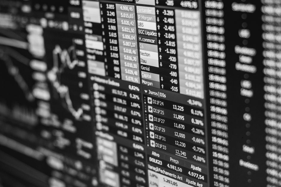 Monochrome stock market data on a screen, illustrating the Nasdaq's recent decline.