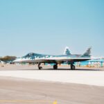 Stock photo of A Sukhoi Su-57 fighter jet stationed on a military airfield runway, used to illustrate this story on DAC Clears ₹2.12 Lakh Crore Defence Acquisitions.