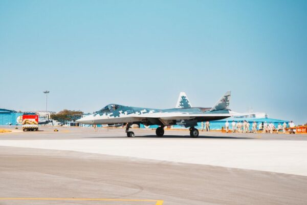 Stock photo of A Sukhoi Su-57 fighter jet stationed on a military airfield runway, used to illustrate this story on DAC Clears ₹2.12 Lakh Crore Defence Acquisitions.
