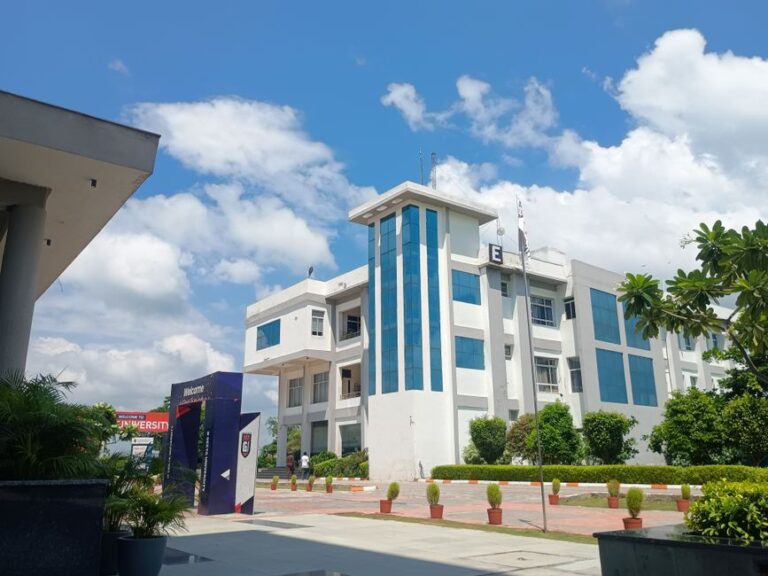 A contemporary university building beneath a blue sky, illustrating a survey on student entrepreneurship in India.