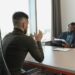 Two men in a modern office interview setting, illustrating SBI's AI Specialist Officer recruitment.