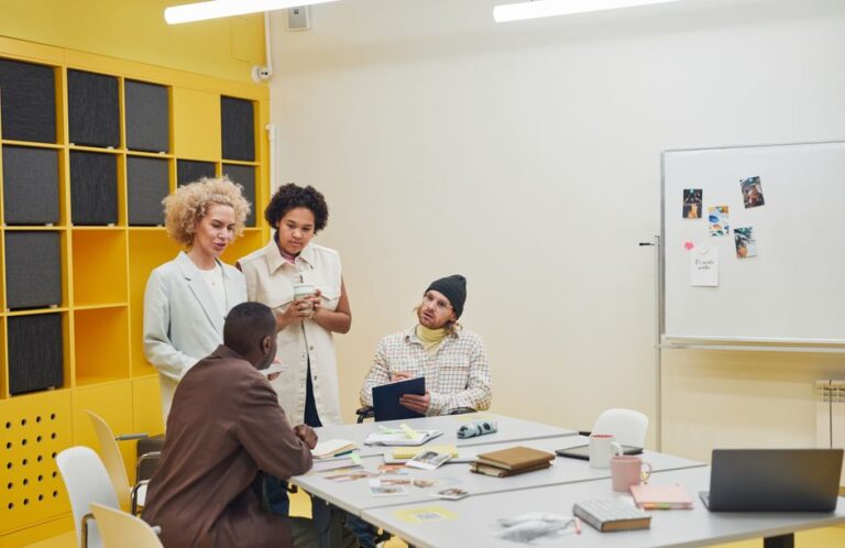 Professionals collaborating in a modern office meeting room, illustrating the trade-offs discussed in management transitions.