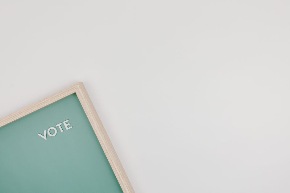 Stock photo of minimalist letter board with VOTE text on a green background, used to illustrate this story on Jamia Orders Student Union Polls Within 15 Days of Constitution Approval.
