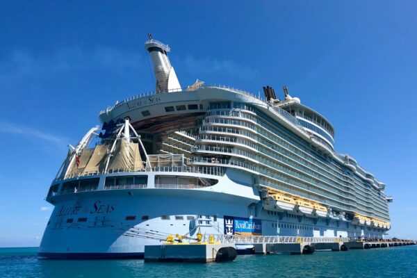 A white cruise ship sailing on a calm sea during daytime, illustrating the suspended Villa Vie Odyssey cruise.