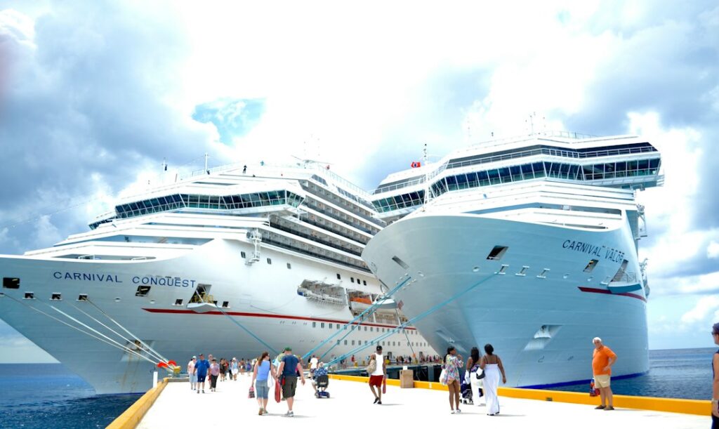A white cruise ship docked during the day, illustrating the cruise industry's fuel hedging decisions.