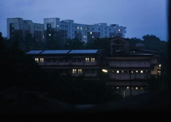 Stock photo of A view of a city at night from a window, used to illustrate this story on UGC Opens Applications for Distance Learning Programs for 2027 Session.