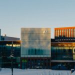 A multi‑windowed building covered in snow, illustrating AI raising entry‑level standards in engineering.