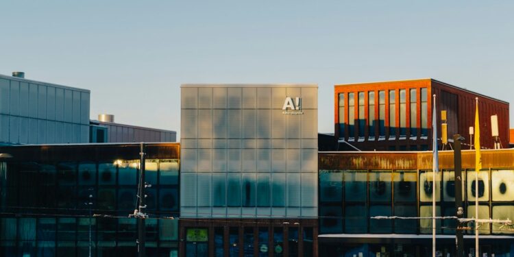 A multi‑windowed building covered in snow, illustrating AI raising entry‑level standards in engineering.