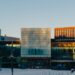 A multi‑windowed building covered in snow, illustrating AI raising entry‑level standards in engineering.