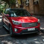Stock photo of A red hyundai creta is parked on a street, used to illustrate this story on Hyundai Launches Bayon, Targets 250,000 Mid-Size SUV Sales.