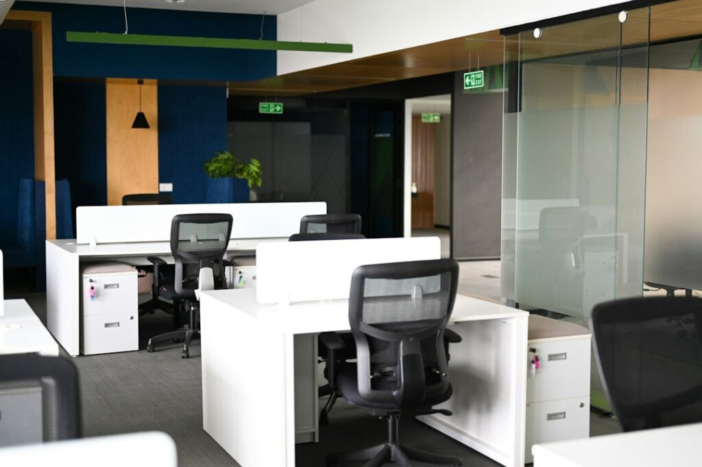 Modern office interior with white desks and black chairs, illustrating Microsoft's corporate revenue report.