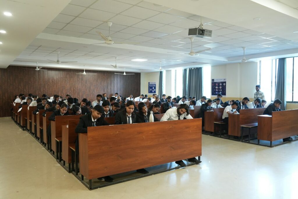 Students attending a lecture in a modern classroom, illustrating the Telangana SSC March 2027 exam fee schedule.