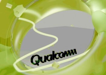 Qualcomm logo visible through a green abstract shape, illustrating the company's plans for global job cuts after annual reviews.