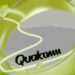 Qualcomm logo visible through a green abstract shape, illustrating the company's plans for global job cuts after annual reviews.