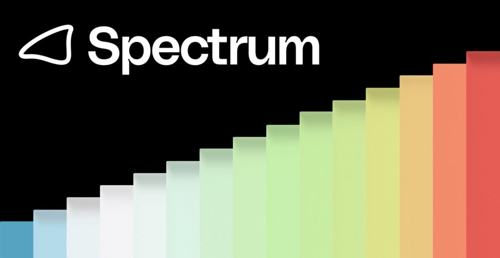 The Photon Spectrum logo in white on a black background above a staircase of colored bars rising from blue to red.